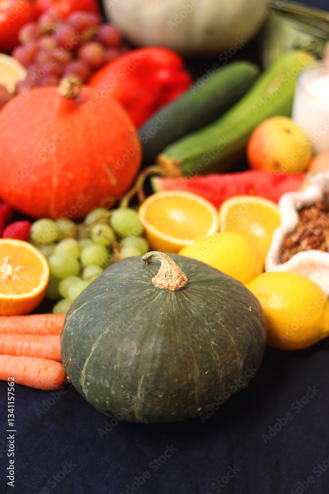 Various healthy fruits, vegetables and cereals on dark background. Selective focus.