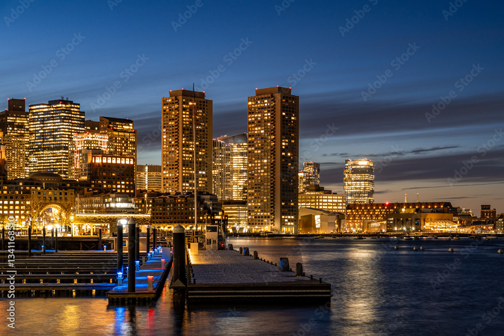 Fototapeta premium View of Boston downtown skyscrapers seen from Seaport District on a cold cloudy winter night