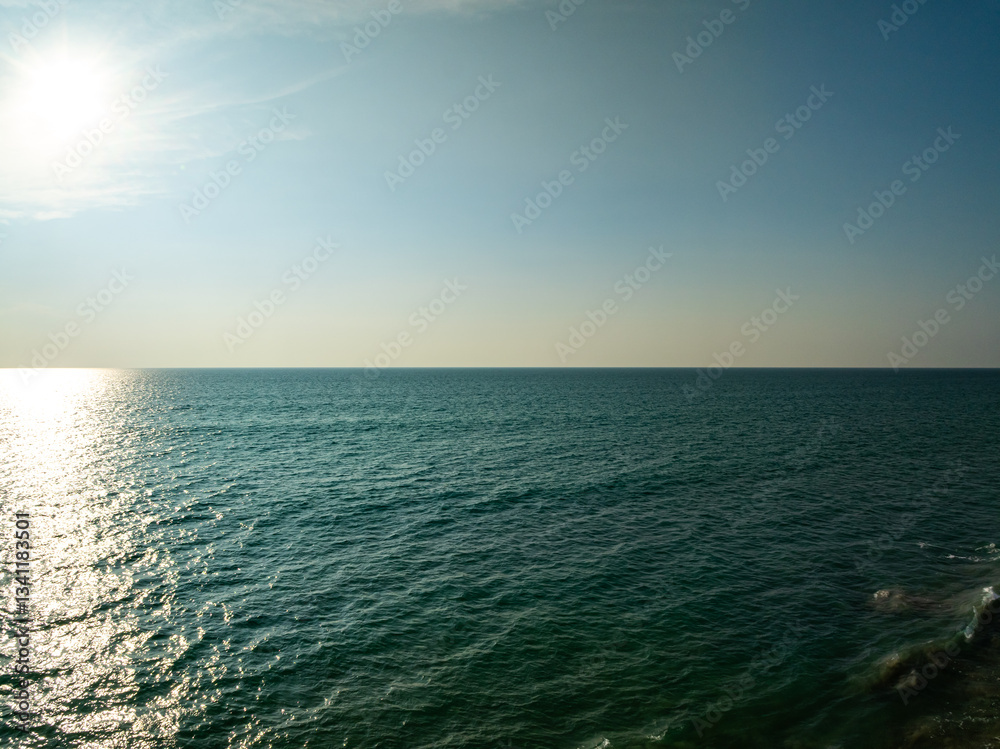 Fototapeta premium Amazing sea background,Summer blue sky over sea background,Beautiful ocean at Phuket island Thailand,High angle view drone shot