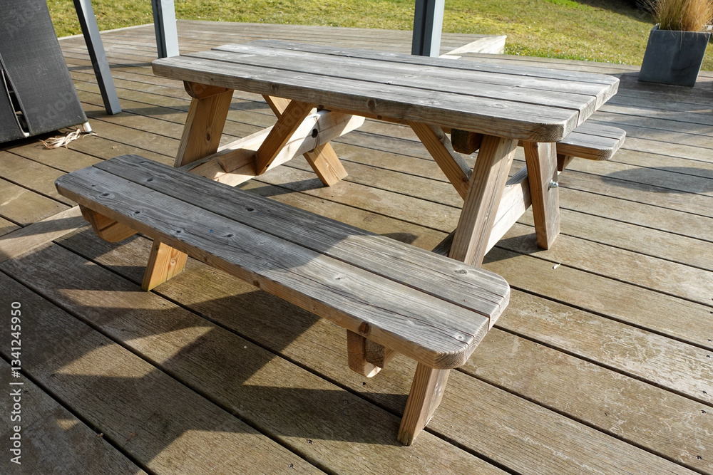 Rustic Wooden Picnic Table on Sunlit Deck Rustic Wooden Picnic Table on Sunlit Deck