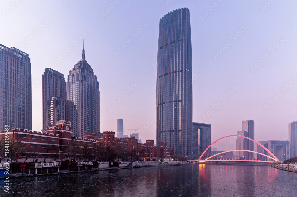 Fototapeta premium sunset waterfront downtown skyline with Tianjin high-rise building cityscape at Haihe riverside, , Tianjin city, China