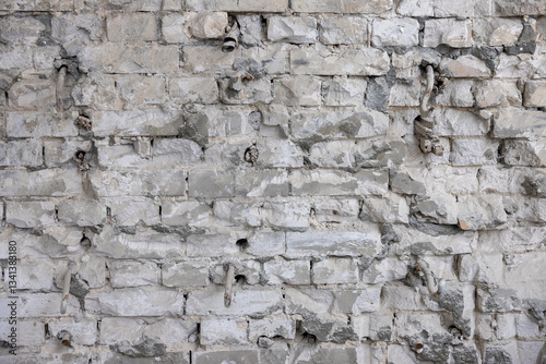 Old exterior brick wall. Old destroyed wall structure in vintage style. Abstract background texture texture. Old exterior wall. Abstract wall with painted grunge background.