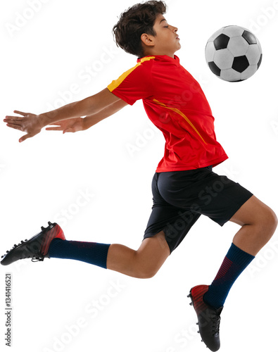 Side view of teenager  football player  dressed black-red soccer uniform  hit ball with chest against transparent background. Concept of sport  junior league  healthy lifestyle  championship.