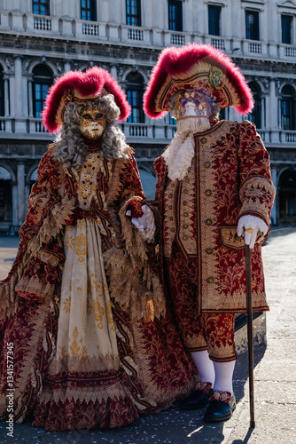 Venetian Carnival Duo: Traditional Masks and Attire