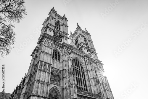 Magnificent towers of Westminster Abbey rise against a clear sky in London. The architectural details showcase the Gothic style, inviting admiration from visitors and locals alike.