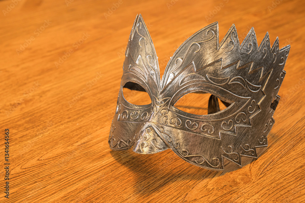Venetian carnival mask on a wooden table