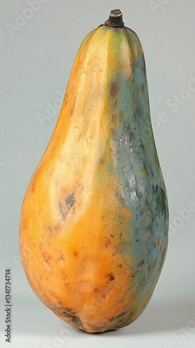 Single papaya, blemishes, studio shot, light gray background