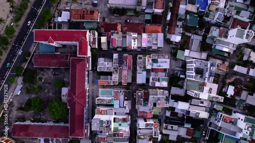 Aerial view of city Nha Trang in Vietnam. Amazing landscape and sunset in turist city in Asia. Popular city in south Asia on ocean shore with blue and ceal ocean.