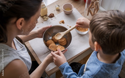 mom and son, Mom and child baking cookies at kitchen table