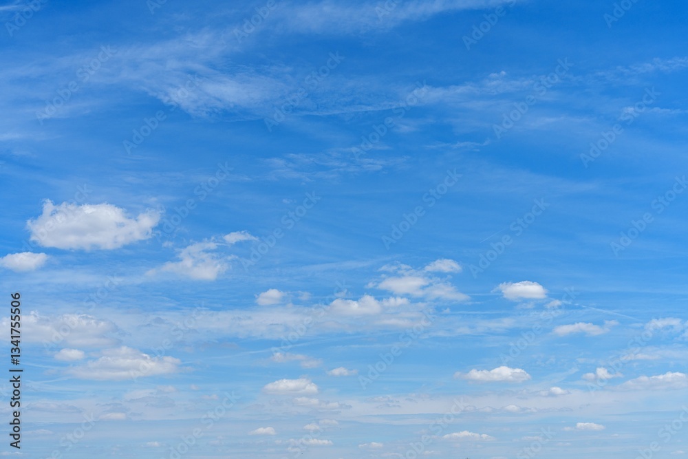 The image features a bright blue sky with scattered fluffy white clouds, creating a serene atmosphere. It captures the essence of a perfect day, ideal for backgrounds and relaxation. The image features a bright blue sky with scattered fluffy white clouds, creating a serene atmosphere. It captures the essence of a perfect day, ideal for backgrounds and relaxation.