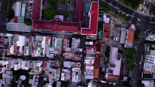 Aerial view of city Nha Trang in Vietnam. Amazing landscape and sunset in turist city in Asia. Popular city in south Asia on ocean shore with blue and ceal ocean.