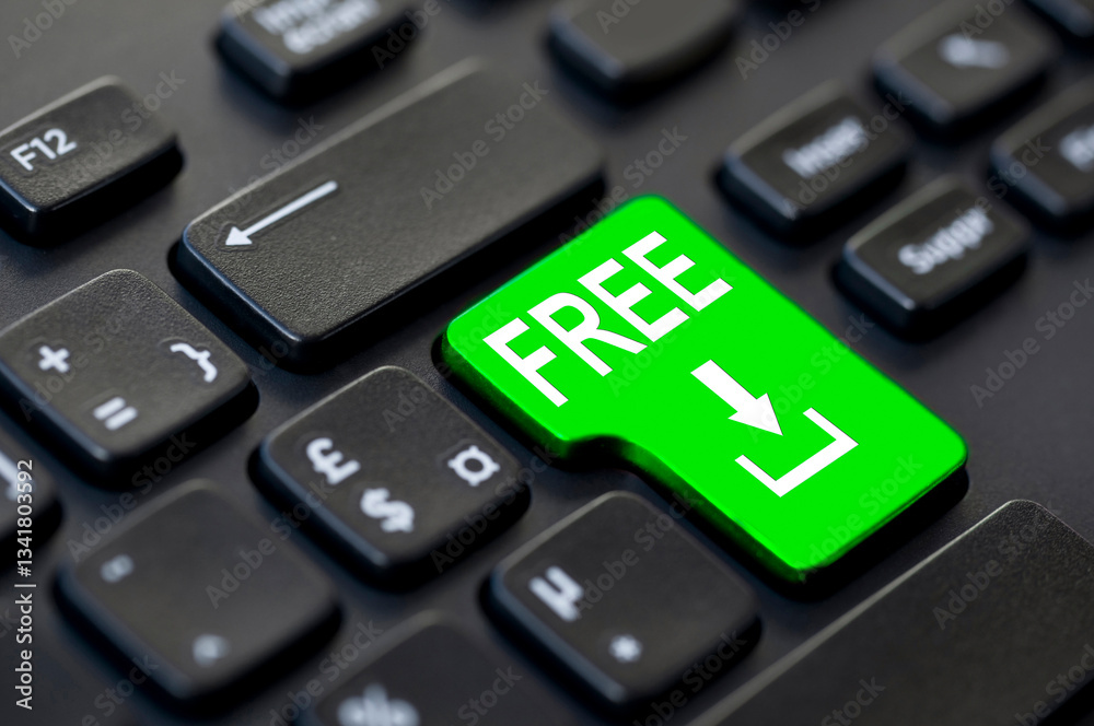 Close up of a green free download return key on a black computer keyboard