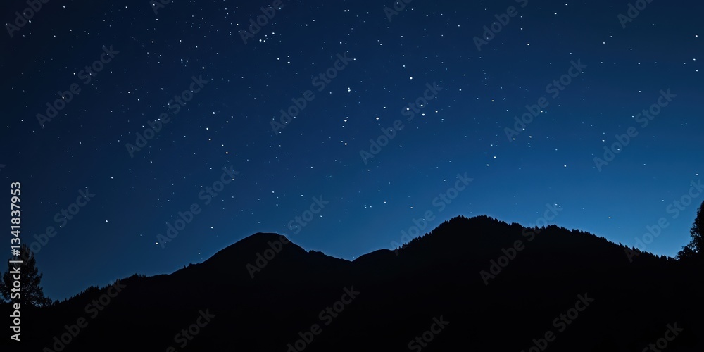 Fototapeta premium Stunning night landscape featuring the bright Milky Way galaxy over majestic mountains. A breathtaking starry sky perfect for nature, astronomy, and adventure themes.