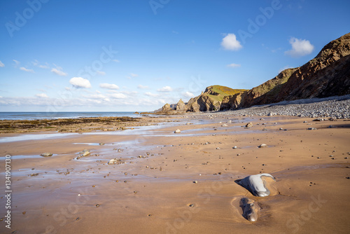 Foto Bright spring sunshine on Sandymouth Bay