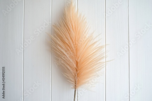 Feather duster rests against a textured white wall indoors Generative AI