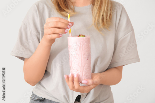 Woman holding glass of tast...