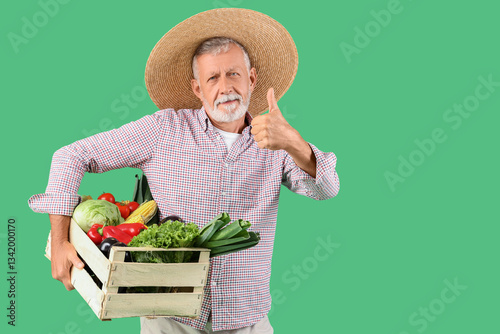 Mature male farmer with woo...