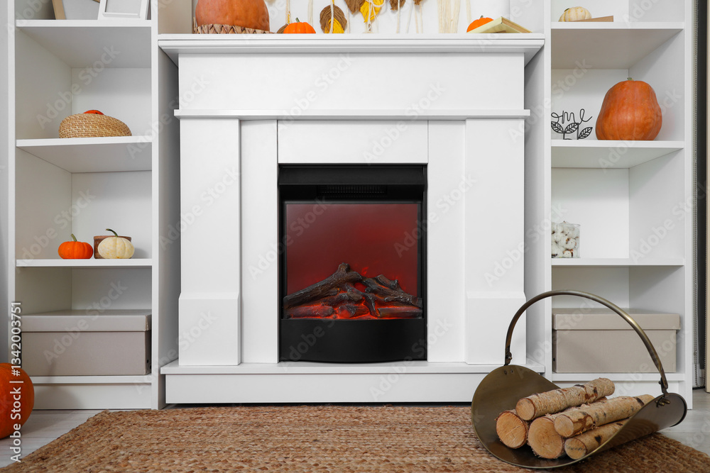 Naklejka premium Interior of living room with pumpkins, fireplace and shelf units