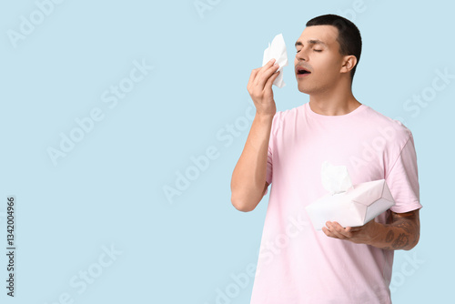 Ill young man with tissues ...