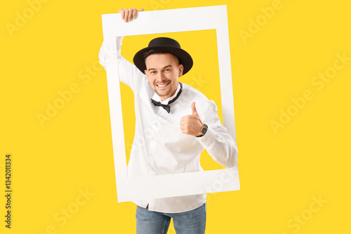 Happy young man with frame ...