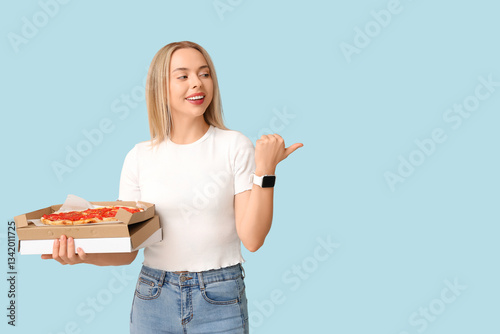Young woman holding cardboa...