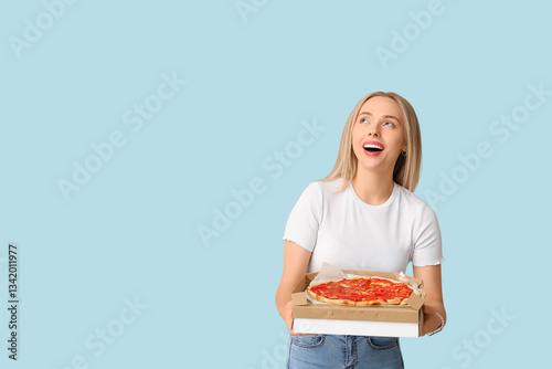 Young happy woman holding c...