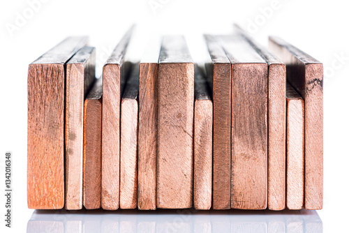 Copper bus bar arranged in a row, insulated on a white background, products of the non-ferrous metal industry