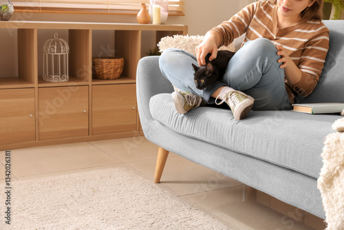 Woman with cute black cat s...