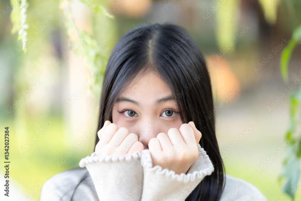 Portrait cute smiles Asian of attractive young teenage girl the cafe on vacation at a coffee shop in spring day
