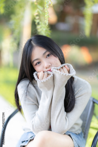 Portrait cute smiles Asian of attractive young teenage girl  the cafe on vacation at a coffee shop in spring day