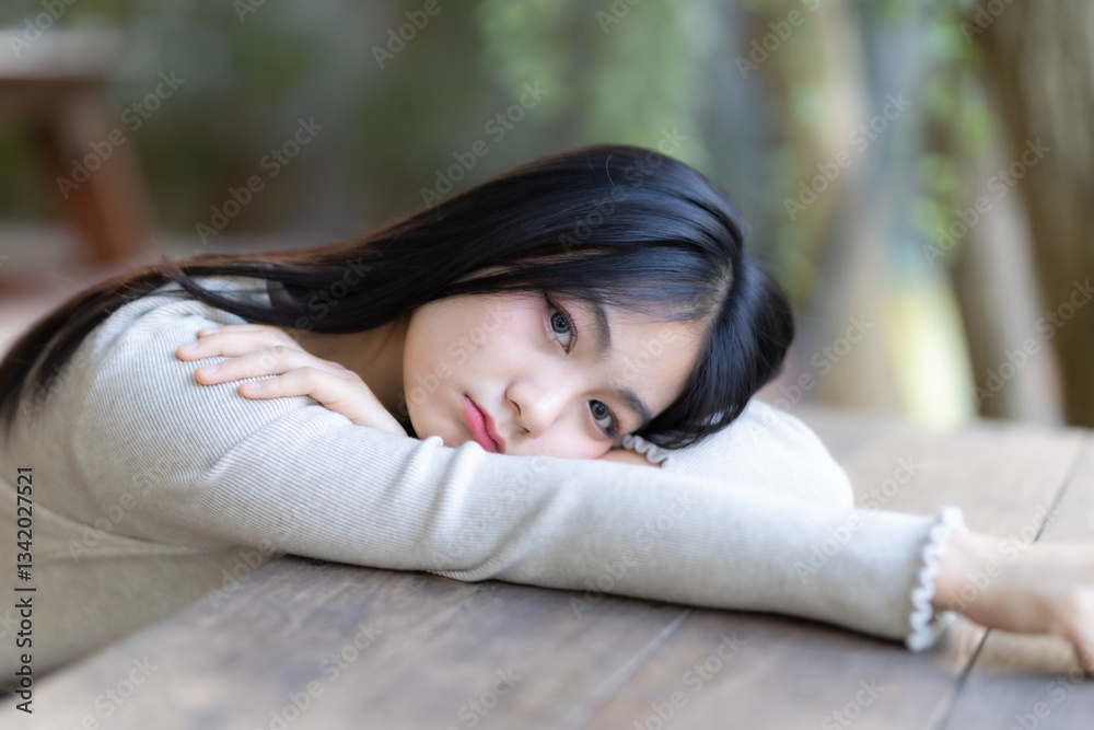 Portrait cute smiles Asian girl putting her hands on table of attractive young teenage girl the cafe on vacation at a coffee shop in spring day