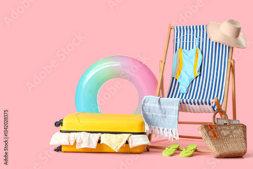 Suitcase with clothes, beac...