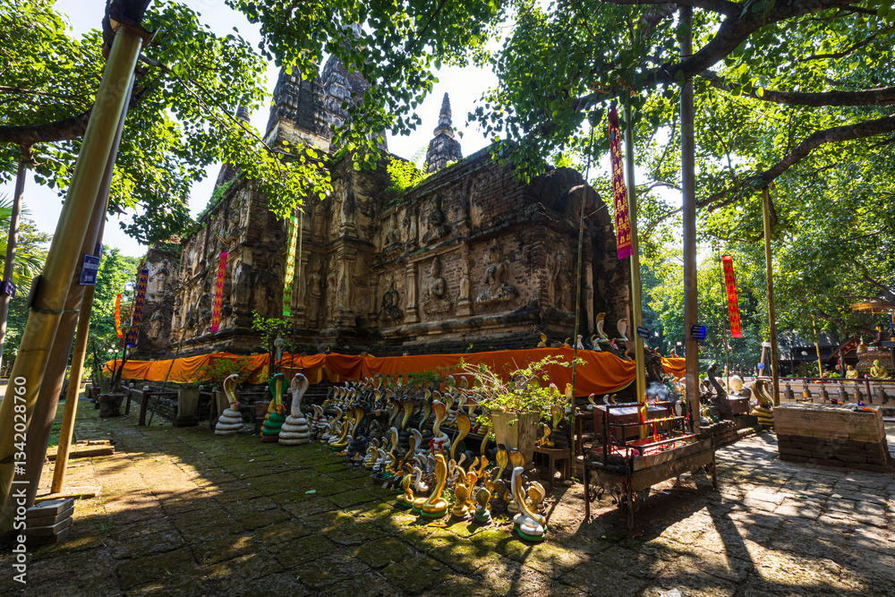 Wat Chet Yot or Wat Photharam Maha Wihan, seven pagoda temple It is a major tourist attraction in Chiang Mai, Thailand.with evening,Temple in Chiang Mai.