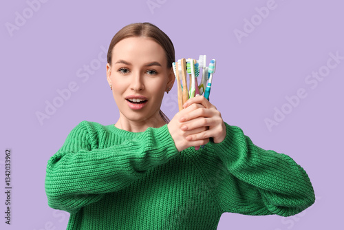 Young woman with toothbrush...