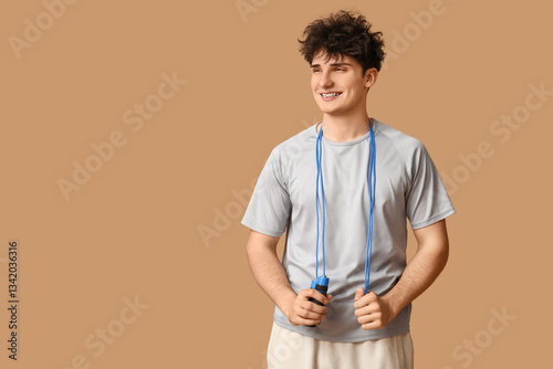 Sporty guy with jumping rop...