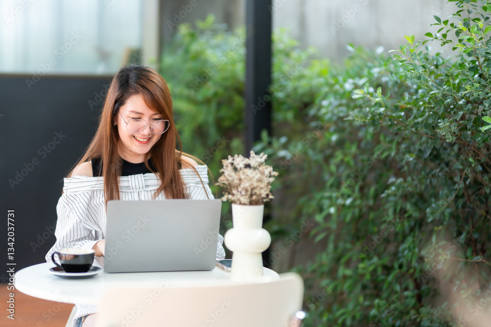 asian freelance people business female talking making using casual working with laptop computer for browsing internet, chatting and blogging and smartphone,notebook in coffee shop.