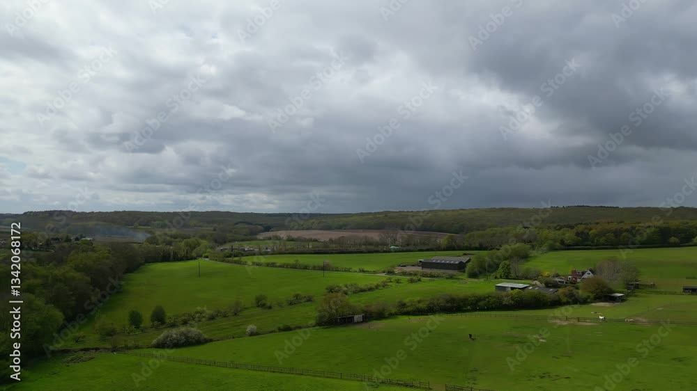 High Angle British Agricultural Farms at Gorgeous Countryside Landscape of England Great Britain of United Kingdom. Footage Was Captured with Drone's Camera from Medium High Altitude High Angle British Agricultural Farms at Gorgeous Countryside Landscape of England Great Britain of United Kingdom. Footage Was Captured with Drone's Camera from Medium High Altitude