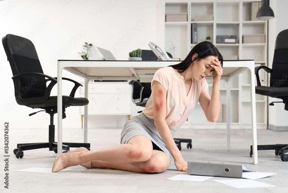 Obraz premium Young businesswoman with folder and bruises on her body fell down in office