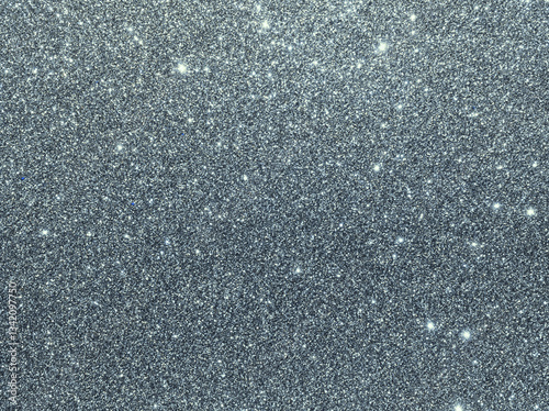 Silver sparkle background. Silver glitter background. Metallic gray glimmer. Abstract twinkle texture. Glitter surface. Glimmer layout. Holiday layout. Diamond luxury surface. Celebration background.