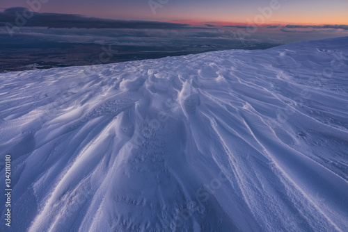 Obraz na płótnie Babia Góra at sunset, covered in winter snow. A stunning mountain landscape in Babia Góra National Park, Poland. Golden light contrasts with icy peaks, creating a breathtaking view for nature and trav w salonie