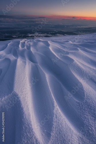 Obraz na płótnie Babia Góra at sunset, covered in winter snow. A stunning mountain landscape in Babia Góra National Park, Poland. Golden light contrasts with icy peaks, creating a breathtaking view for nature and trav w salonie