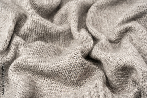 Grey wool sweater texture as a background.
