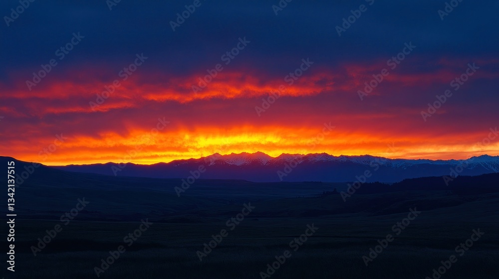 Fototapeta premium Fiery Sunrise over Mountain Range