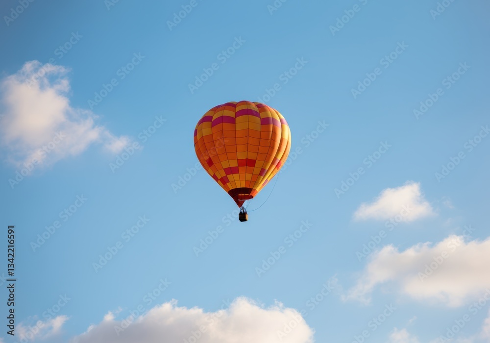 Fototapeta premium Colorful hot air balloon soaring in a clear blue sky