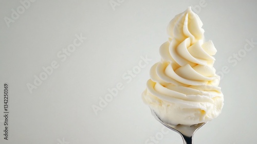 Creamy swirls of frosting on a spoon