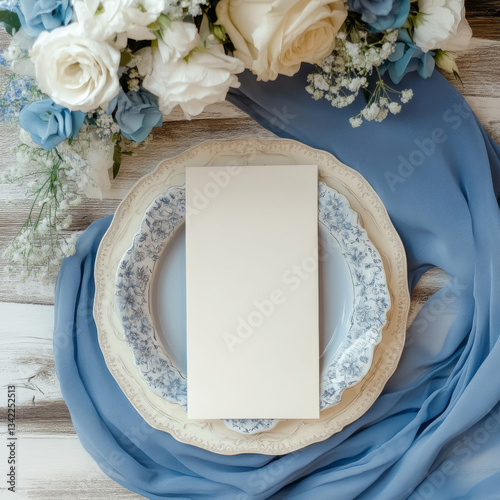 Spring wedding invitation mockup with blue fabric and white floral arrangement