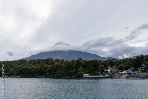 Scenic lake surrounded by rolling hills and lush forests. A breathtaking natural landscape where water, mountains, and greenery blend in perfect harmony, offering a peaceful and immersive view of natu