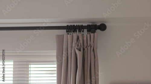 Wallpaper Mural The curtains hang on a black cornice in the bedroom and living room. This is a decoration of modern design. Torontodigital.ca