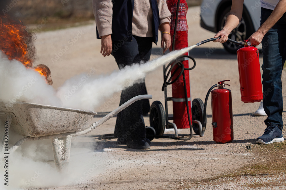 Obraz premium Fire extinguisher used during fire drill
