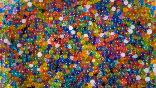 Water beads close-up, abstract background. Texture of Hydrogel balls or many colorful orbeez for wallpaper.